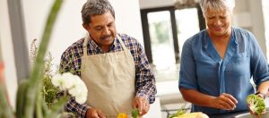 Senior ouple cooking healthy food together