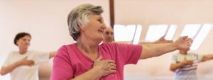 Senior woman in exercise class