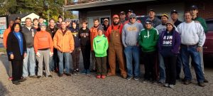 The group from Brother Rice High School gathers in the parking lot before heading out to help Meals on Wheels recipients. 