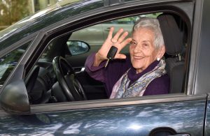 senior woman holds keys