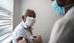 senior receiving Covid-19 vaccine