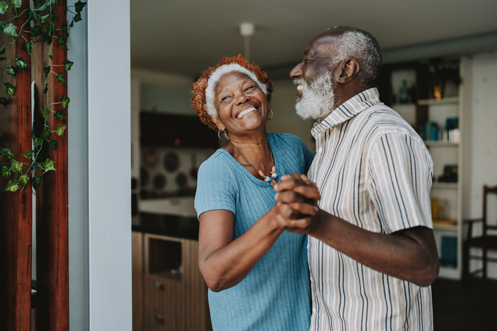 Portrait senior couple dancing together