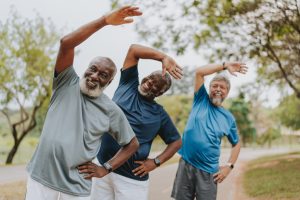 Group of elderly friends exercising by stretching